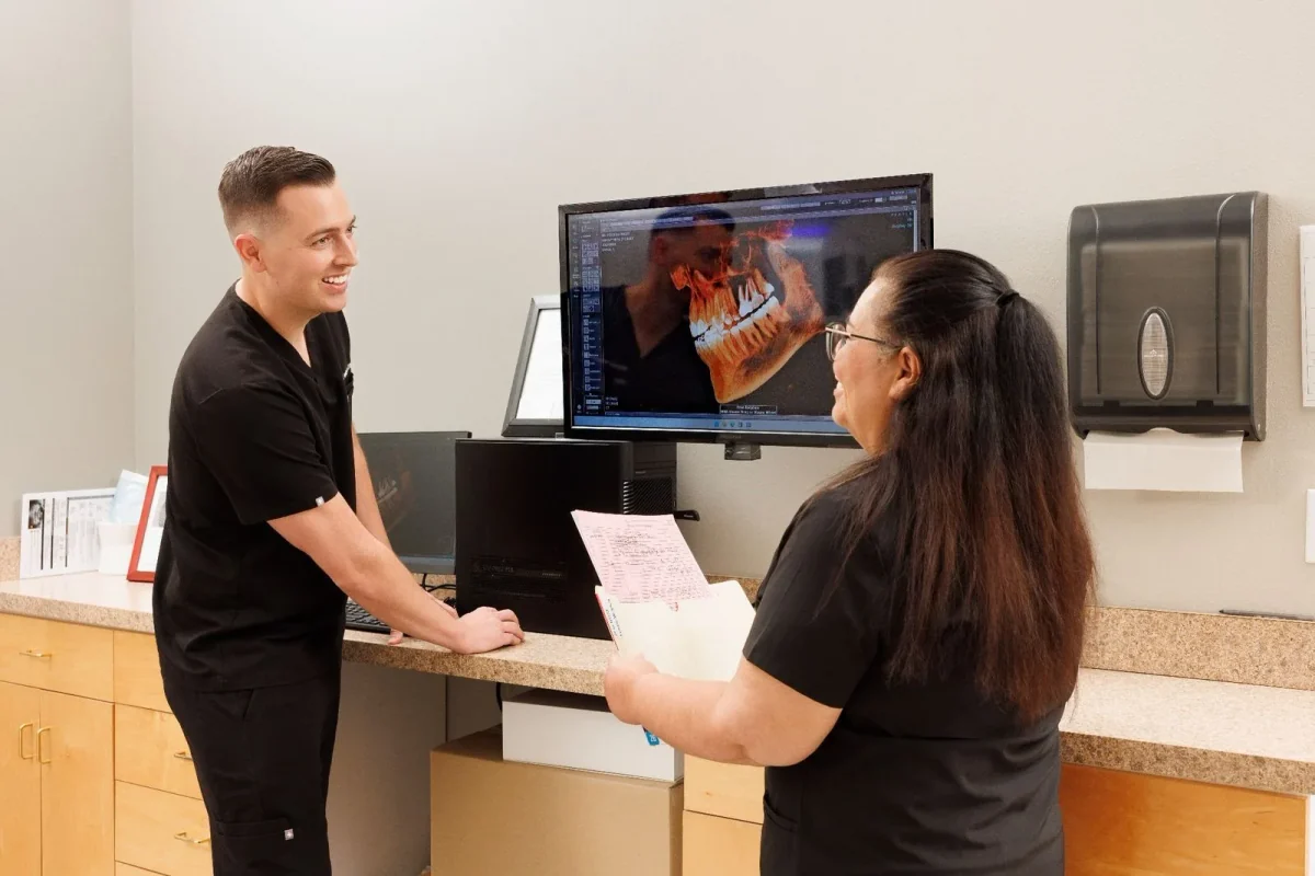 Team members reviewing digital X-ray imaging together